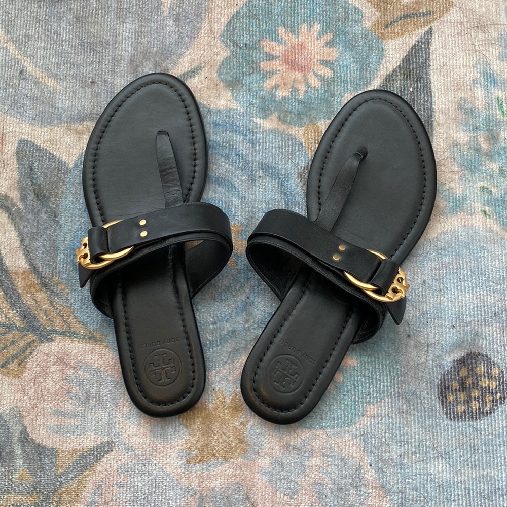 Never worn Tory Burch black thong sandals with gold hardware